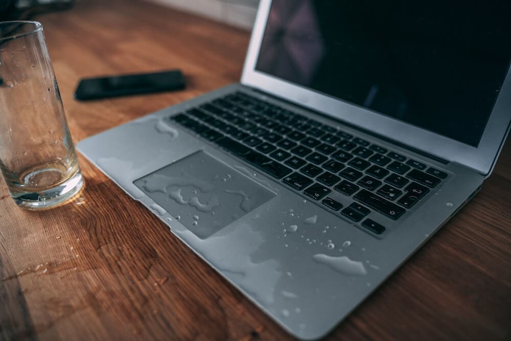 Water from a glass spilled on laptop
