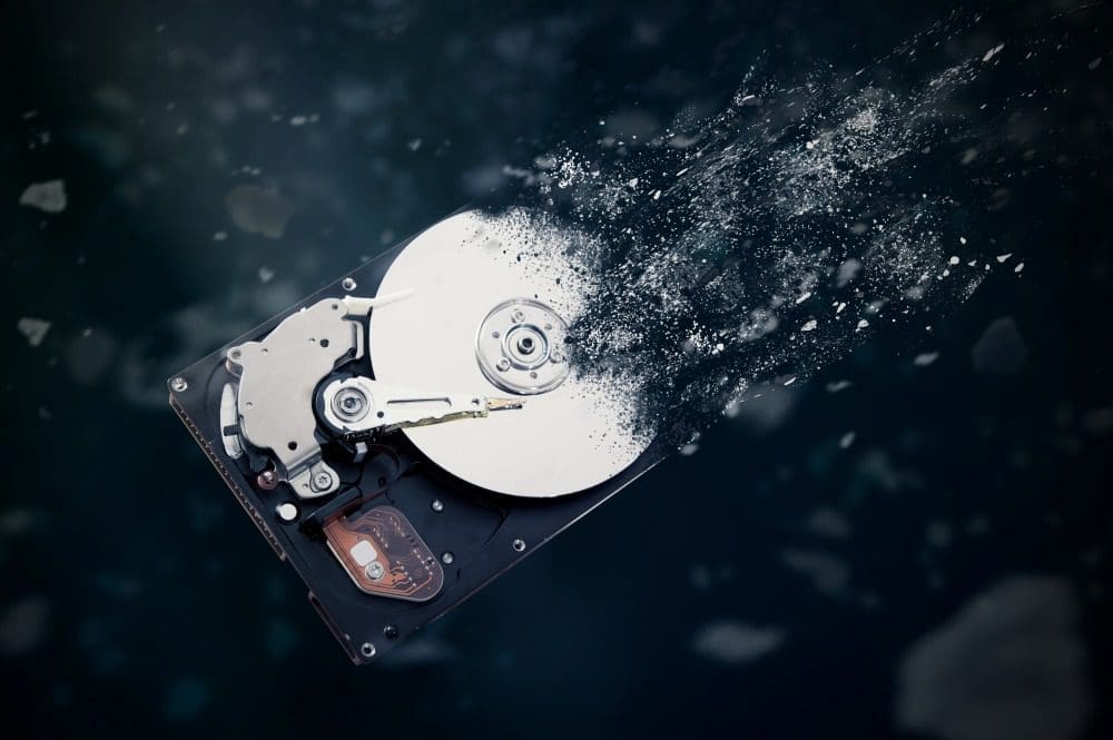An old hard drive being destroyed.
