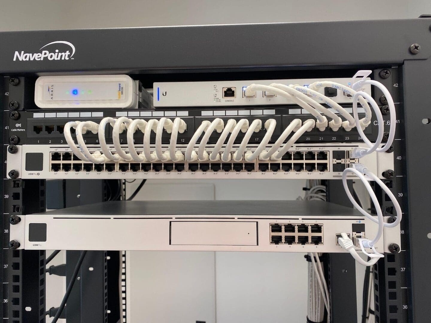 Server rack with network cables and equipment.