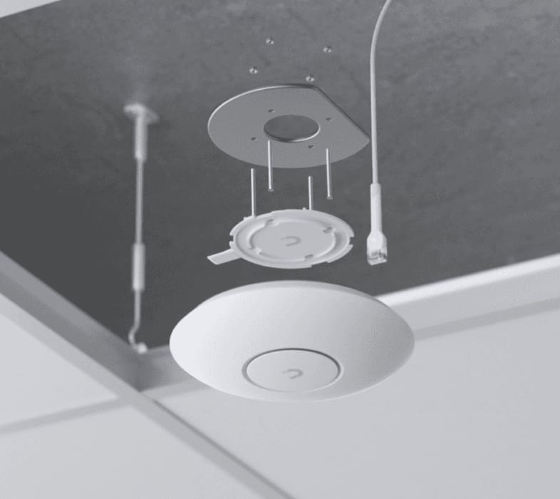 Ceiling-mounted wireless access point installation.