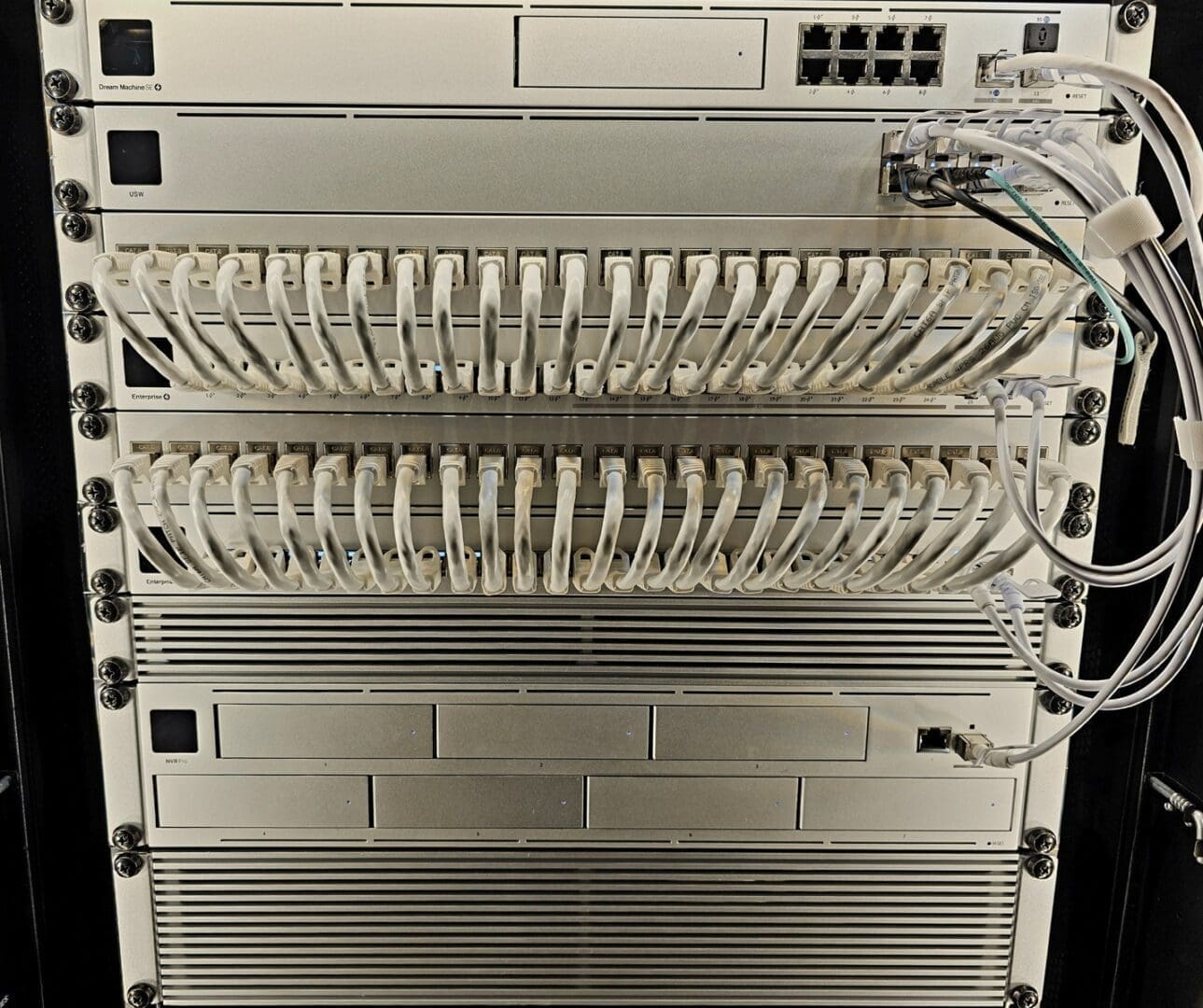 Server rack with numerous connected cables.