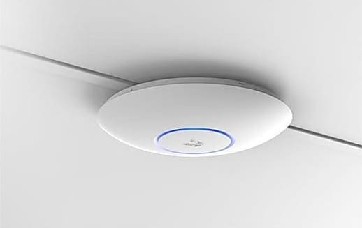 Ceiling-mounted wireless access point device.