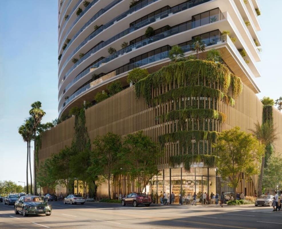 Modern building with greenery on facade.