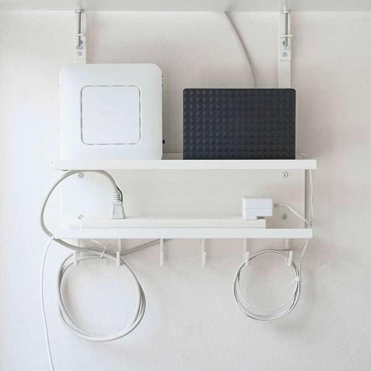 Router and modem on a white shelf.
